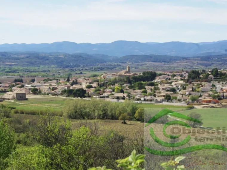 TERRAIN 650M2-CENTRE VILLAGE-PLAT